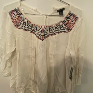 White blouse with cool designs